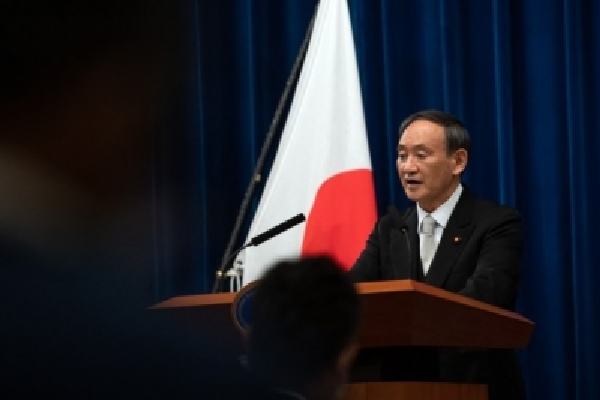 japan pm cancels trips to india philippines over covid