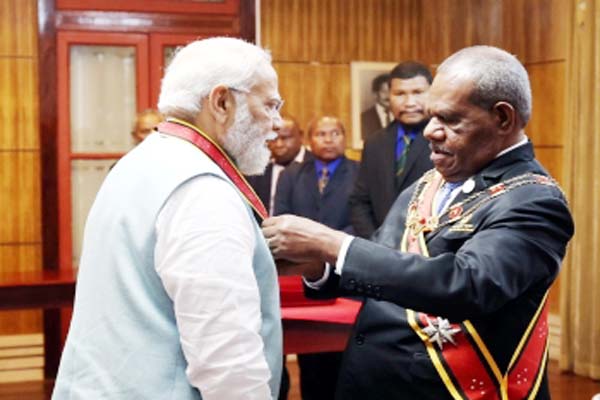 pm modi honored with papua new guineas highest civilian award