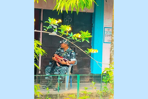 photo of security jawan babysitting for voter at polling station melts hearts