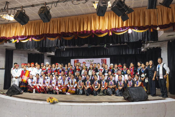 Members of 16 kindred tribes including Darlong, Kuki, and Molsom in traditional attire on stage at the UNAU Cultural Meet 2026, Agartala.