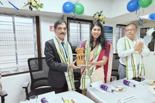 TGB Chairman Satyendra Singh presenting an Ashoka Stambha memento to DM North Tripura Chandni Chandran during the Dharmanagar branch inauguration.
