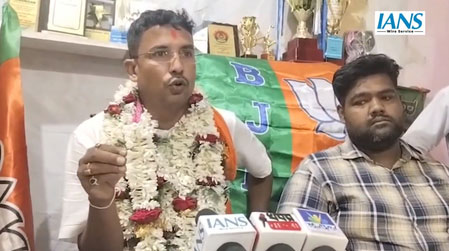 BJP candidate Tarak Saha, a former Tripura State Rifles soldier, campaigning with supporters in the Swarupnagar constituency of West Bengal.