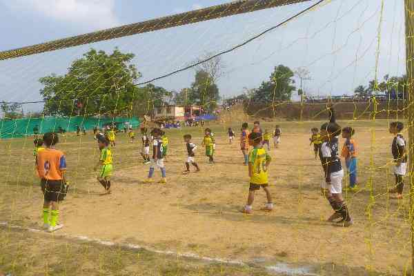 Young football players and community members gathered at the Behliangchhip playground in Jampui Hills for the YMA tournament opening ceremony.
