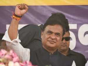 Assam CM Himanta Biswa Sarma showing a victory sign during a massive election rally in 2026.