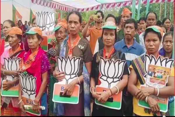 Janajati women listening to CM's TTAADC poll campaign with saffron party symbol, Lotus at Dhalai