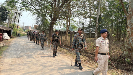 Tripura State Police and CAPF personnel conducting a flag march in hill Tripura ahead of April 12 TTAADC elections for peaceful polling process.
