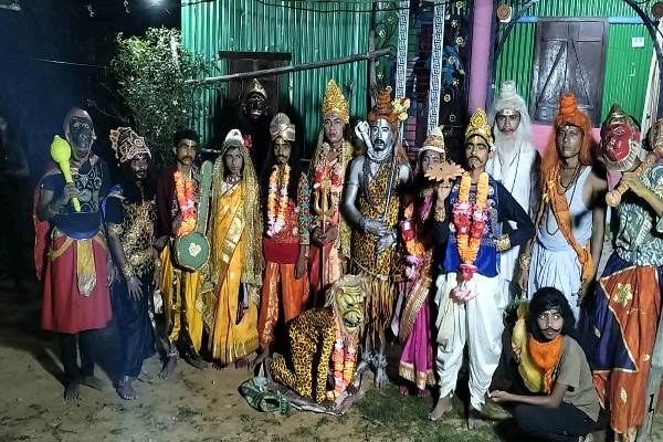 Young performers in Tripura dressed as Lord Shiva and Parvati performing the traditional Har-Gauri dance during Shiber Gajan in Shantir Bazar.