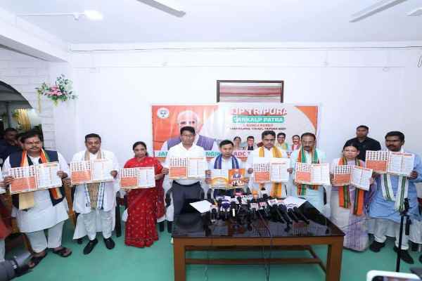 Chief Minister Dr Manik Saha and BJP leaders Rajib Bhattacharjee, Rebati Tripura, Santana Chakma, and Bikash Debbarma releasing the 29-point Sankalp Patra at Khumulwng for the TTAADC elections.