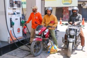 Vehicles lined up at a petrol pump in Agartala after petrol price hike across the country amid global crude oil crisis