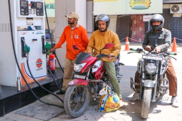 Vehicles lined up at a petrol pump in Agartala after petrol price hike across the country amid global crude oil crisis