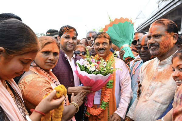 Jahar Chakraborti celebrating victory with supporters as BJP retains Dharmanagar Assembly seat in by-election.