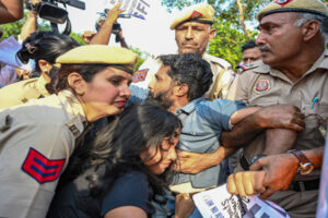 Police detain protesters during demonstrations over the NEET-UG 2026 paper leak controversy in New Delhi