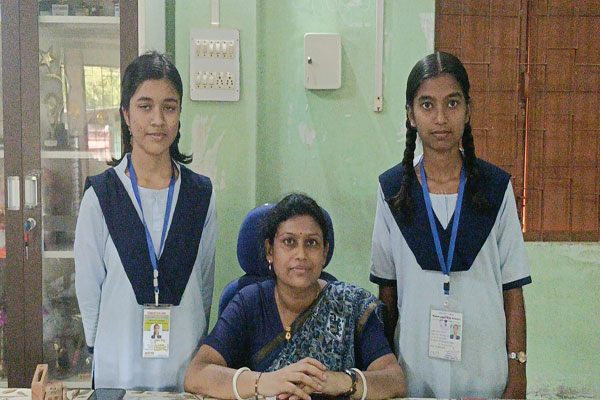 Diya Debnath & Sneha Dey posed with acting HM Panchali Bhattacharjee,of Ramkrishna Higher Secondary School, Kailashahar.
