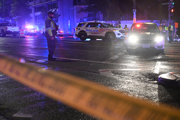 Secret Service and police vehicles secure area after White House shooting incident in Washington DC in which the suspected gunman was killed.