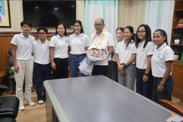 Manipur Chief Minister Yumnam Khemchand Singh interacting with nine SAFF championship-winning women footballers at the CMO in Imphal.