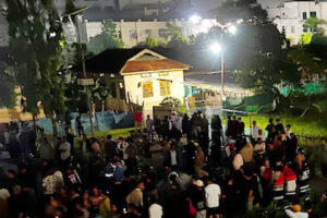 Crowd and security forces outside JNIMS mortuary Imphal East after recovery of six Naga villagers bodies in Manipur