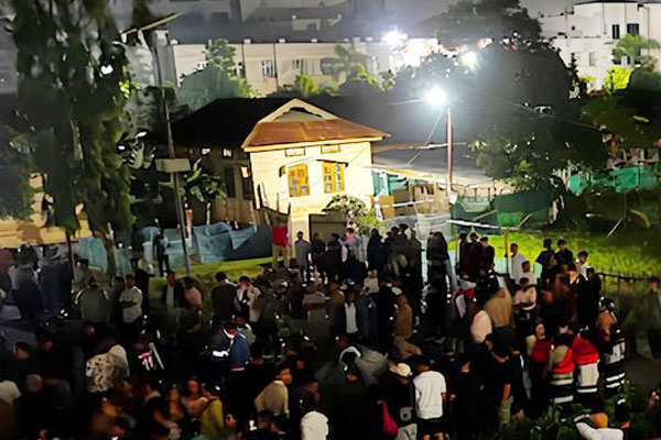 Crowd and security forces outside JNIMS mortuary Imphal East after recovery of six Naga villagers bodies in Manipur