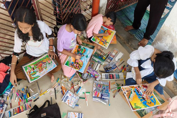 Children participating in a Goddess Durga drawing competition held as part of Mahalaya cultural events at Teliamura in Tripura